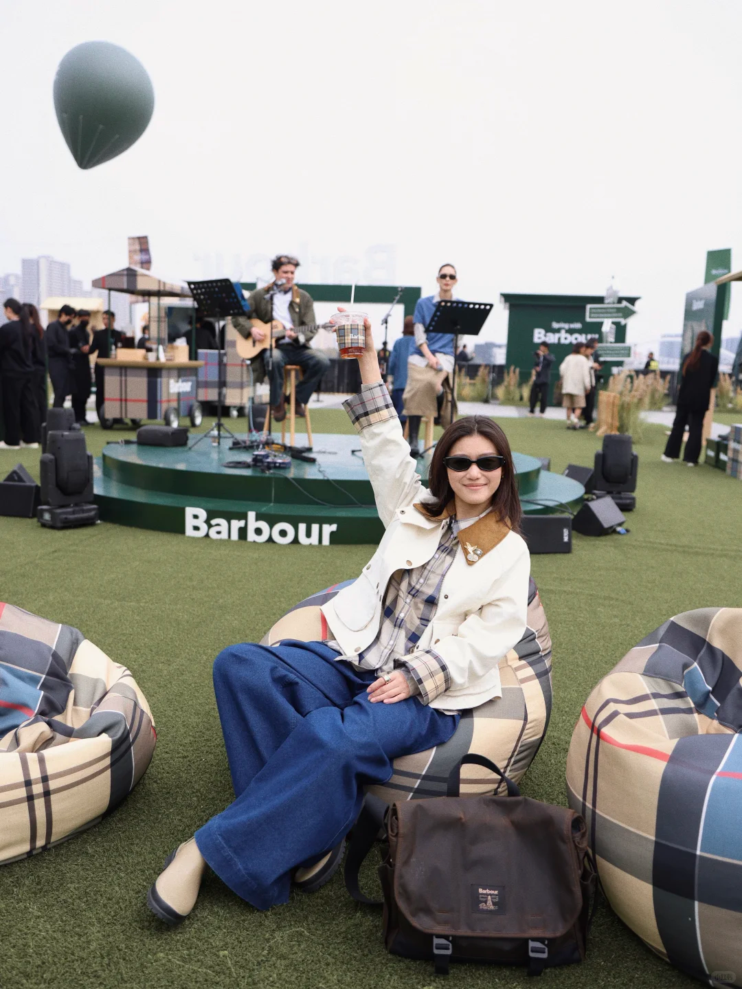 Guest at Barbour event on plaid bean bags