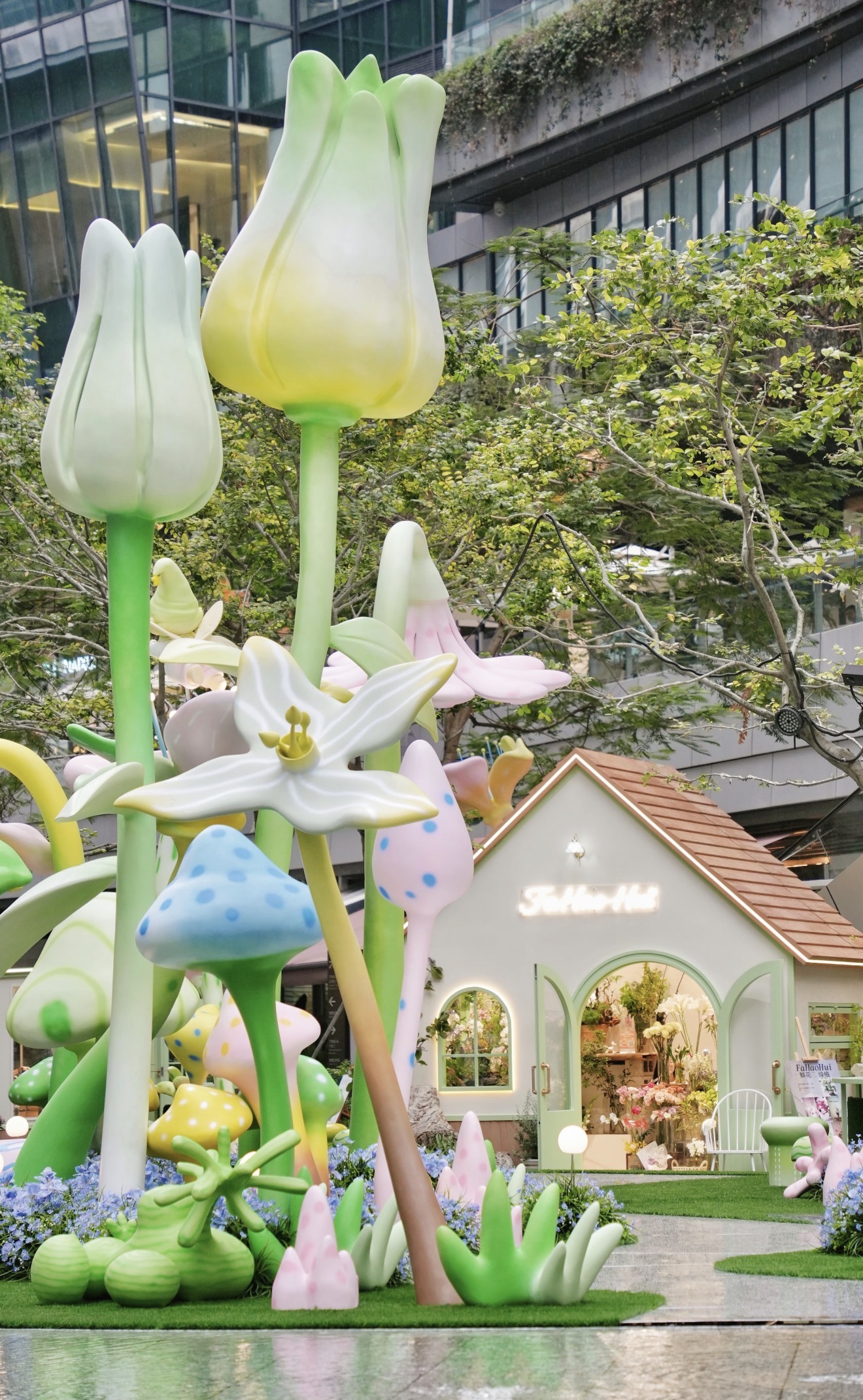 Giant botanical sculptural installation with shopfront exterior